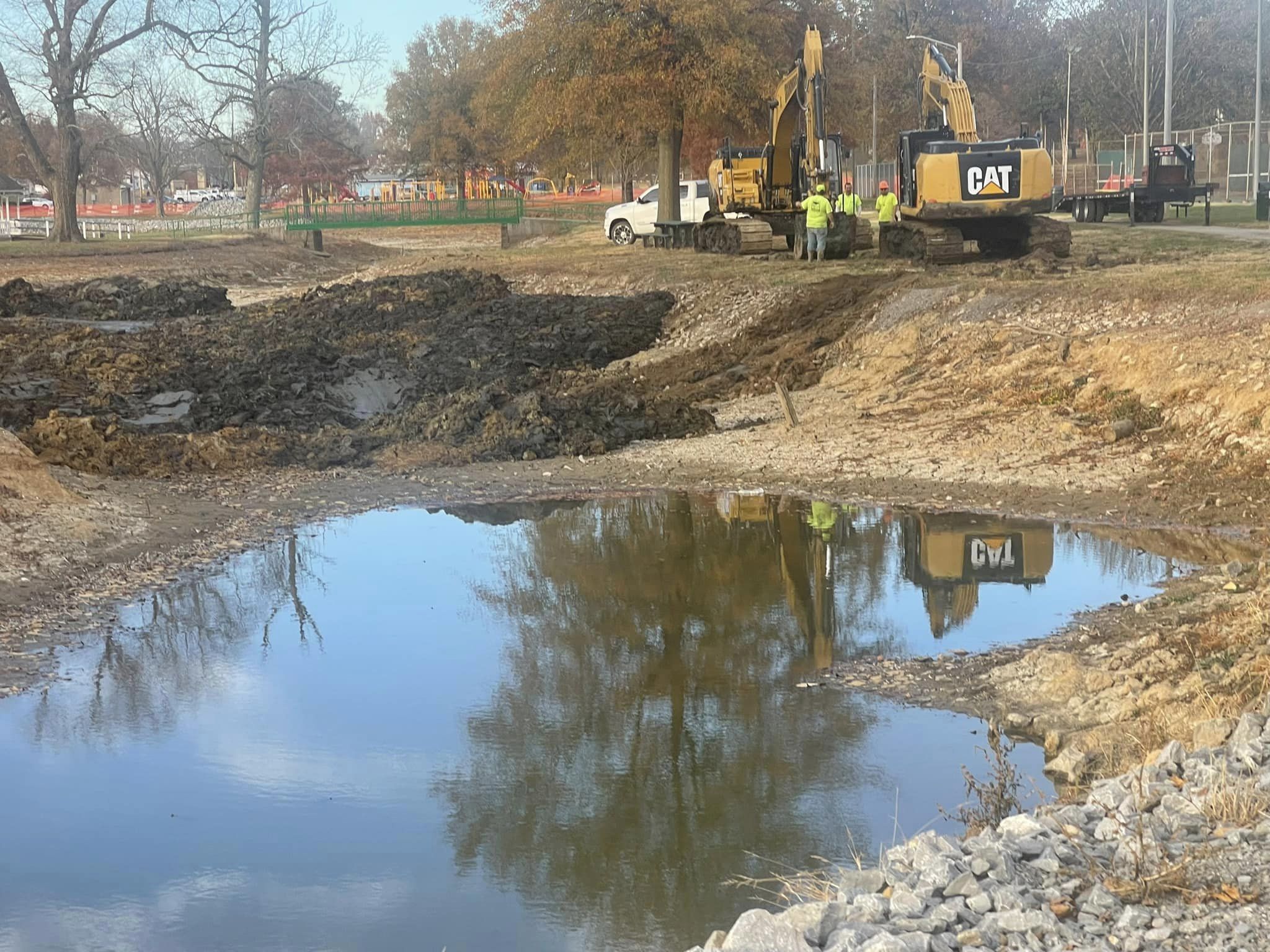 Lake with backhoe by it